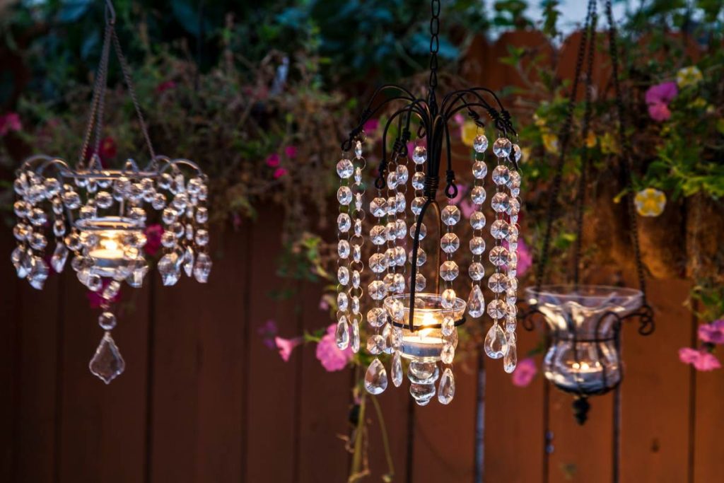 Clear Outdoor Chandeliers next to fence